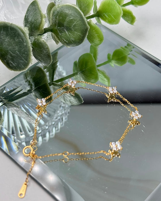 Vergoldetes 925er Silberarmband mit kleinen Zirconia-Blumen, 17–22 cm